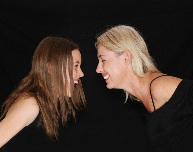 mother and daughter smiling