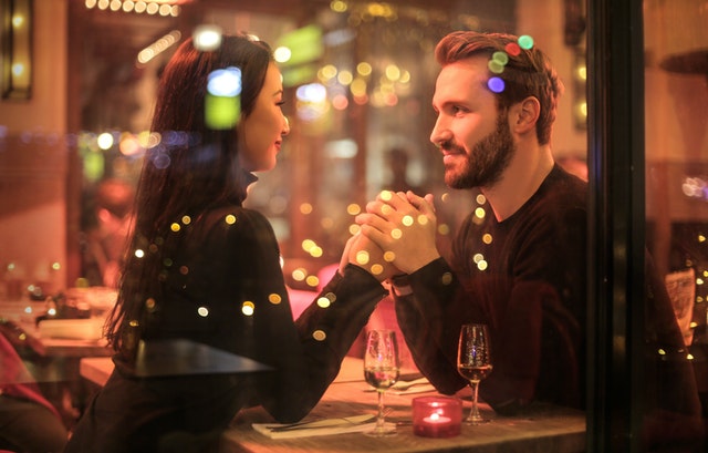 photo of couple holding hands