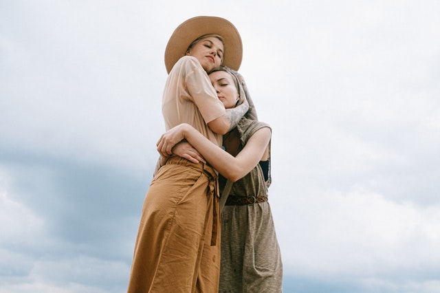 women hugging each other