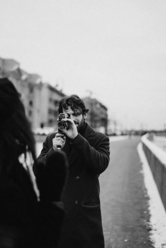 man taking photo of a woman