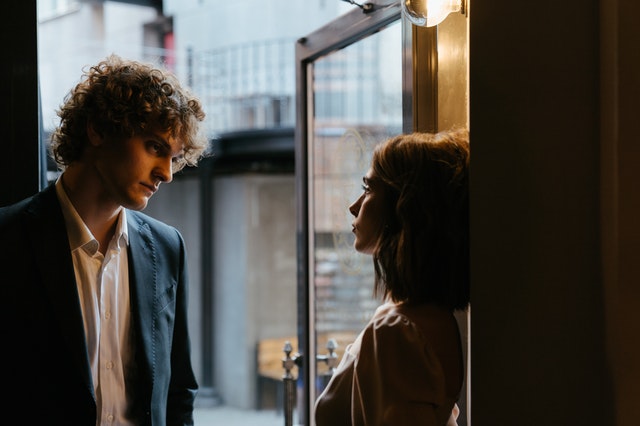 man and woman staring each other