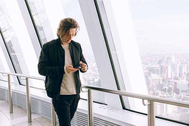 man checking on his phone