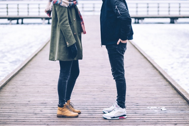 couple standing in front of each other