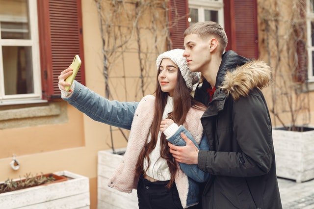 does my ex still love me man and woman taking selfie