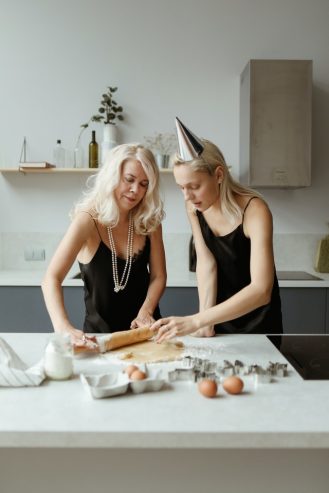 mom and daughter preparing a dough