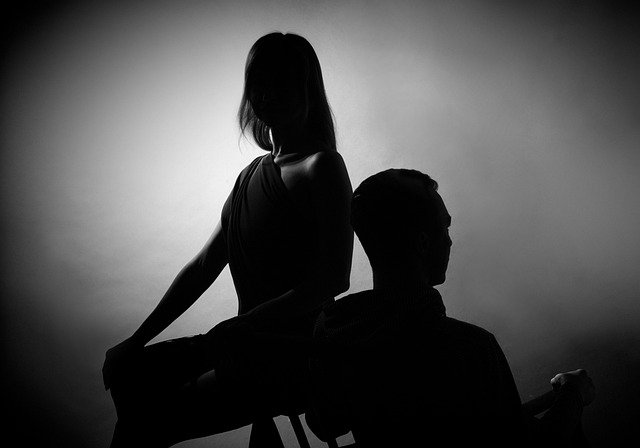 silhouette photo of a man and woman