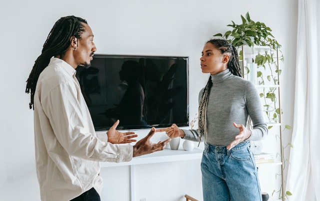 young ethnic couple having argument at home