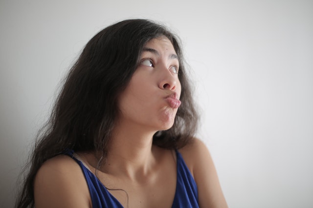 woman pouting her lips