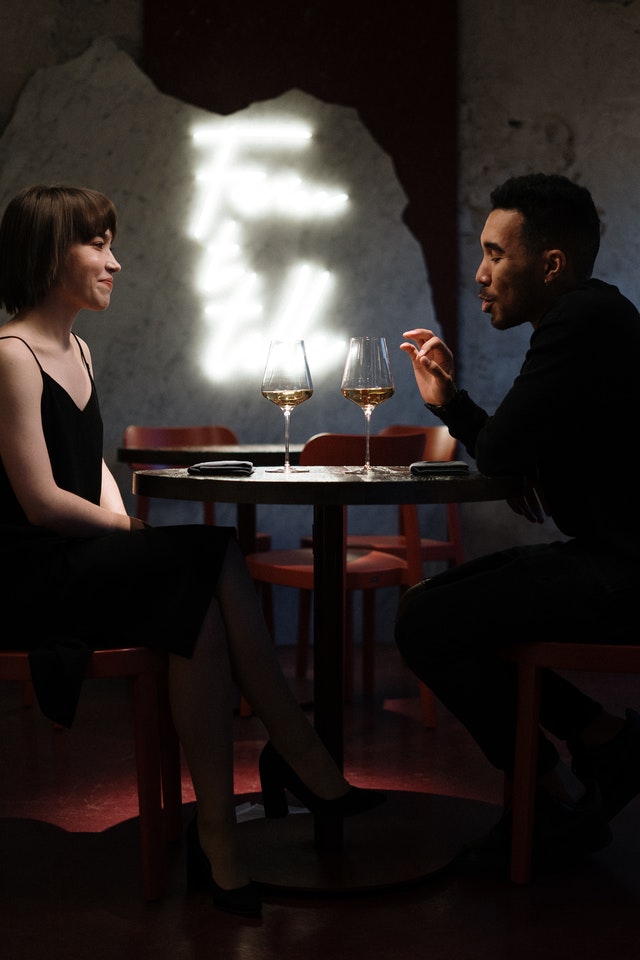 man and woman having a dinner date