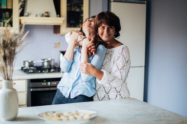 mother hugging her daughter