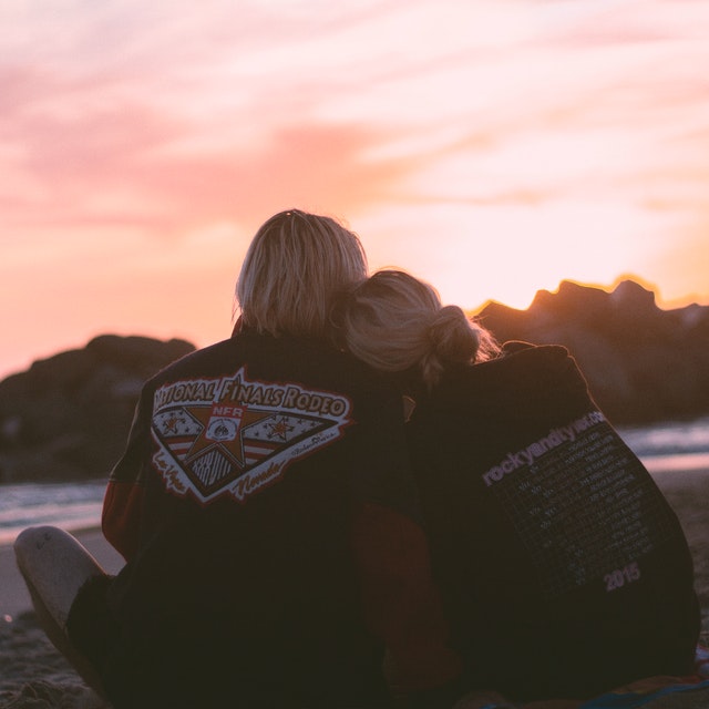 couple leaning with each other
