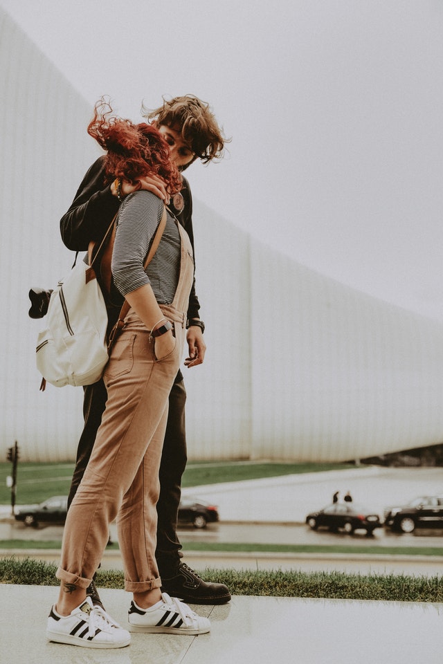 man and woman kissing
