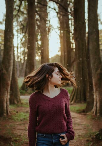woman wearing glasses with wavy hair